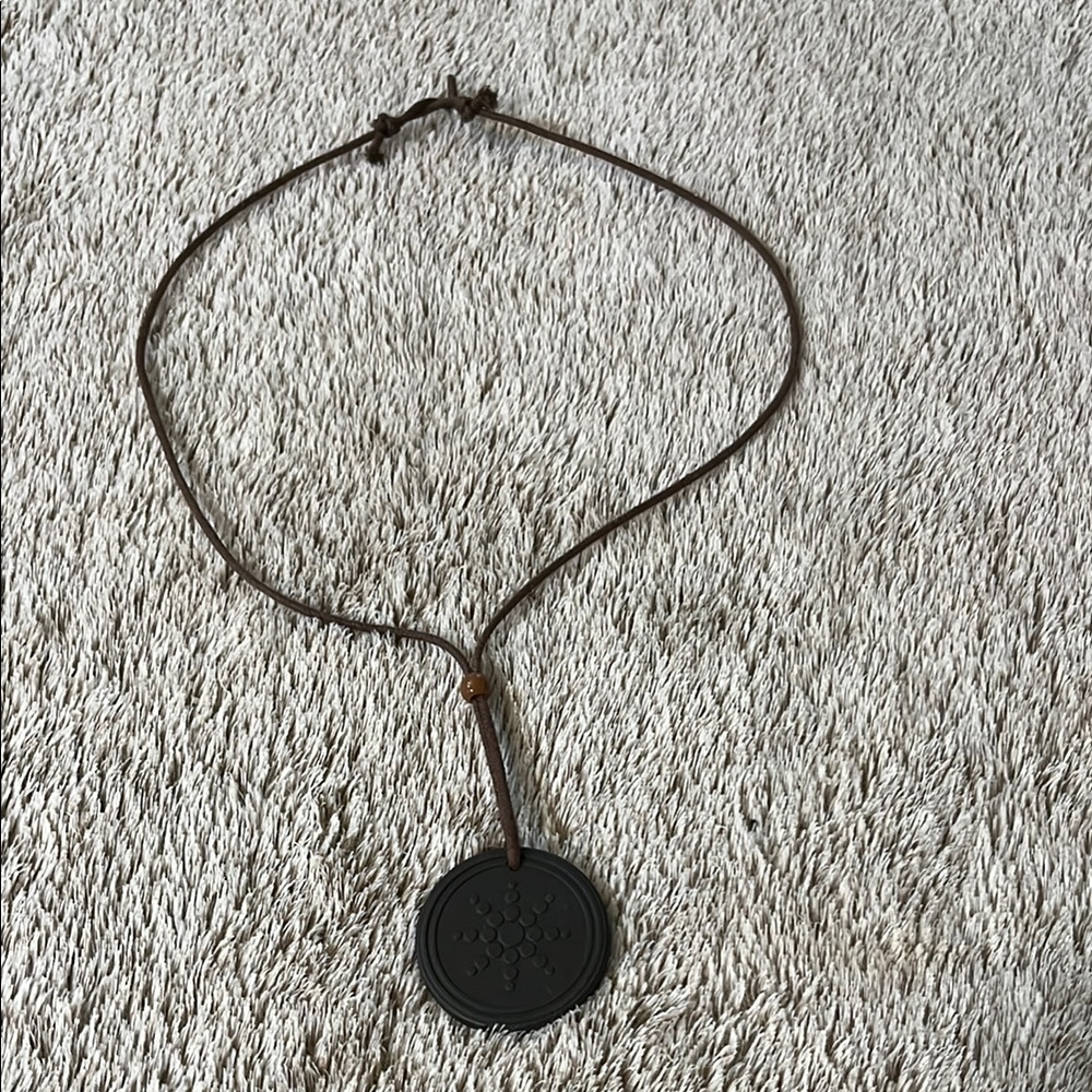 Round Black Pendant on Brown Cord
